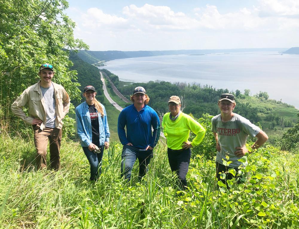 Mississippi Valley Conservancy interns take a break after a day of land restoration projects.