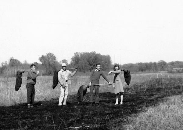 Mary Helgren Johnson helping with prescribed burn led by Aldo Leopold