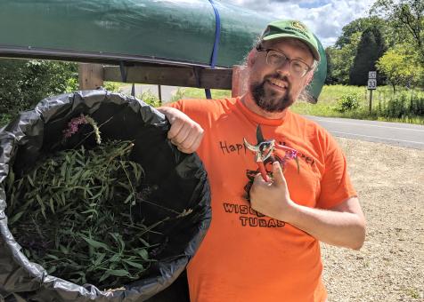 Wallrath after removing invasives on canoe trip