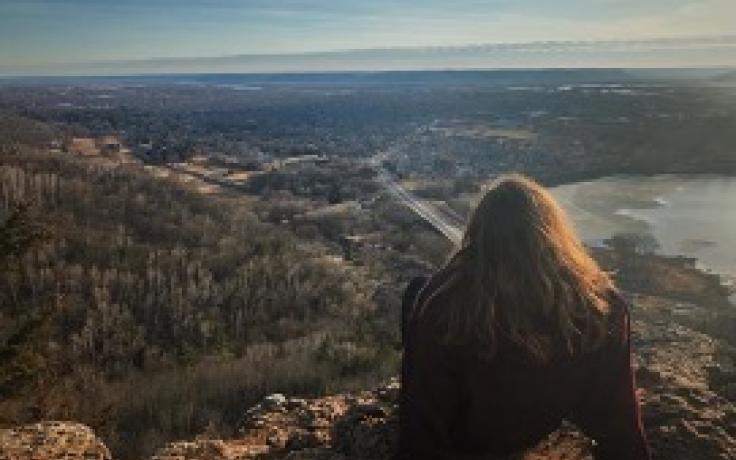 The author sitting bluff side, looking over the city of La Crosse.