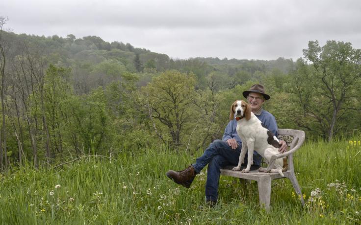 Pete Quirin and his hound, Susie, enjoy a look over newly protected land